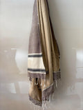 HANDWOVEN KIKOY TOWEL IN TAUP ON CARAMEL